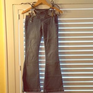 Hip-hugger, bikini tie, side zip jeans